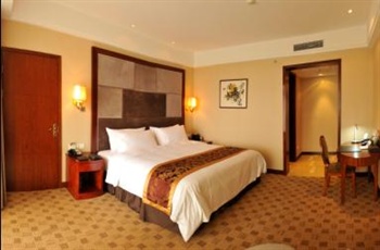 自贡檀木林城市名人酒店行政套房卧室
